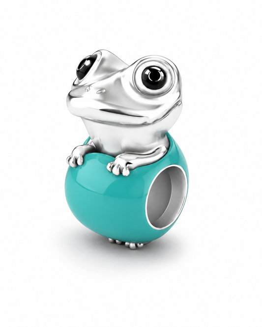 Baby frog charm in polished 950 sterling silver with glossy black enamel eyes, on a glossy Tiffany-blue enamel egg bead — handcrafted jewelry by Priscilla Sayegh