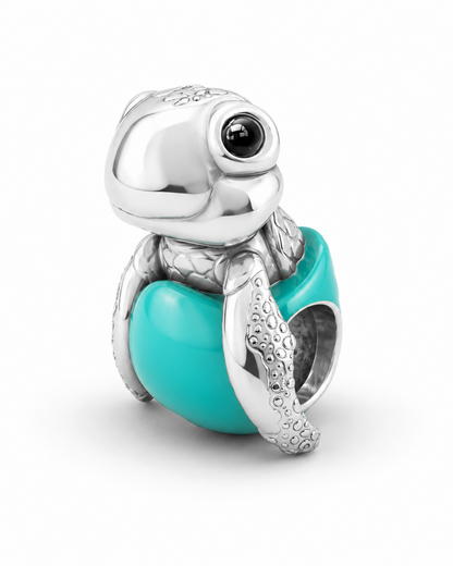 Baby sea turtle charm in polished 950 sterling silver with glossy black enamel eyes, on a glossy Tiffany-blue enamel egg bead — handcrafted jewelry by Priscilla Sayegh